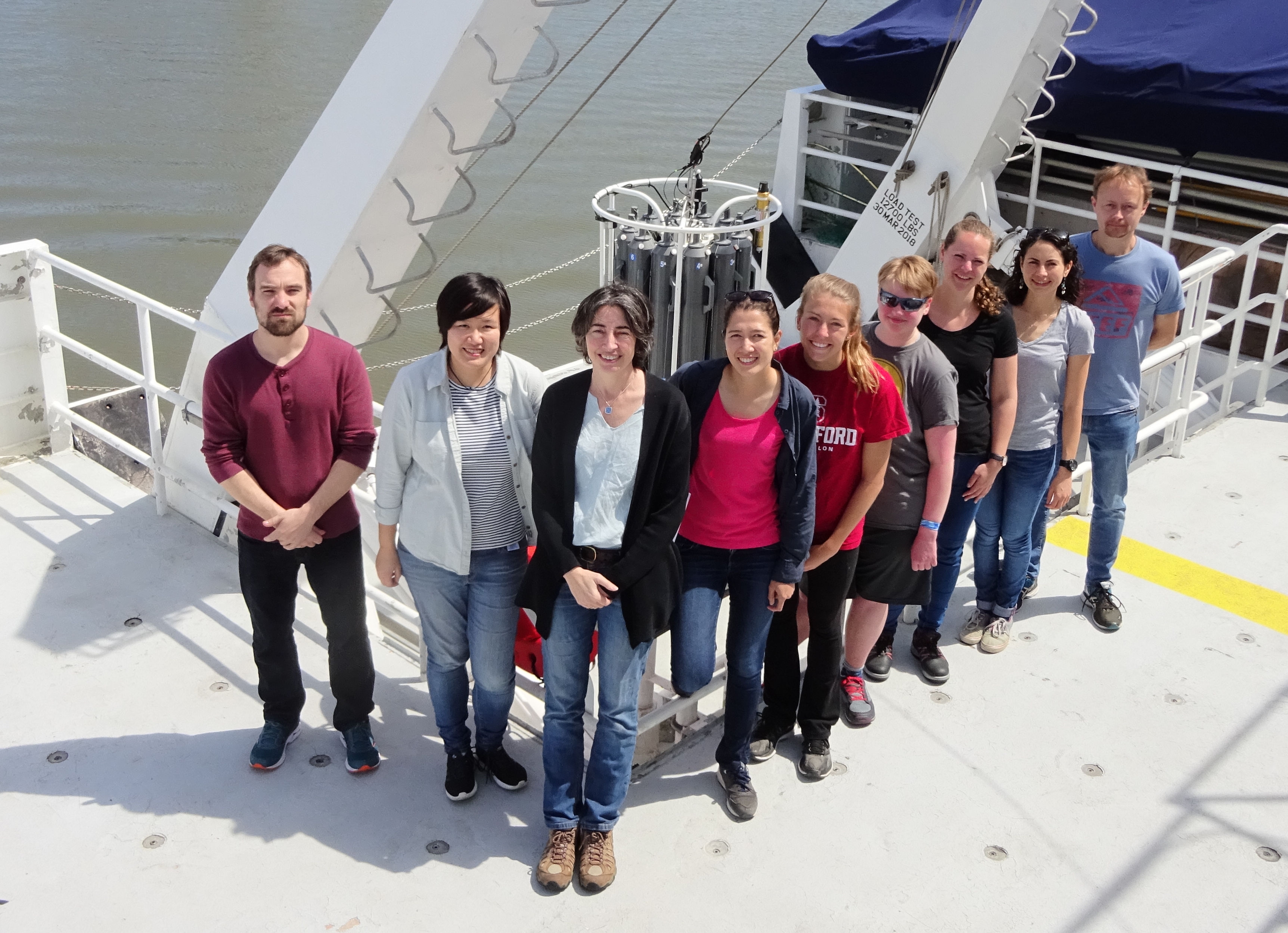 MBL Senior Scientist Alex Worden, front, with her team members from several institutes preparing for a research cruise. Credit: Alex Worden