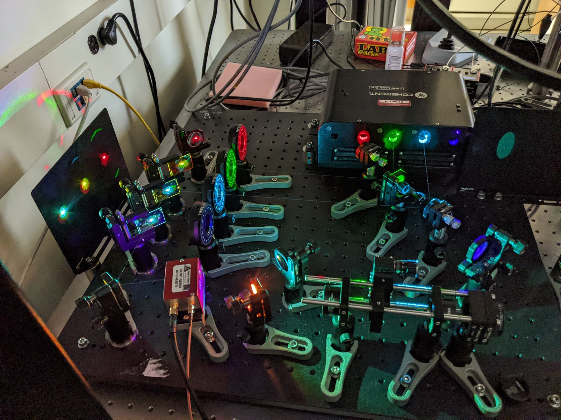 This home built laser sled is an illumination source for the line scanning fluorescence microscope. Four visible lasers (405, 488, 561 and 640 nm) are combined using mirrors and dichroics. Designed and built by Matthew Parent, MBL. Credit: Emily Greenhalgh