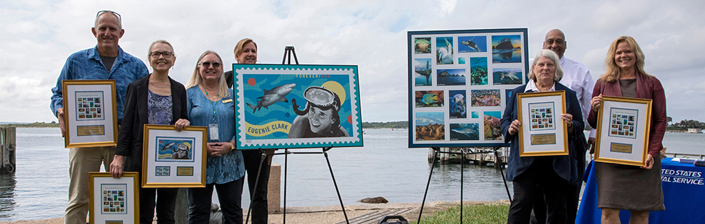 Woods Hole scientific leadership join USPS officials to commemorate ocean-themed stamps. 