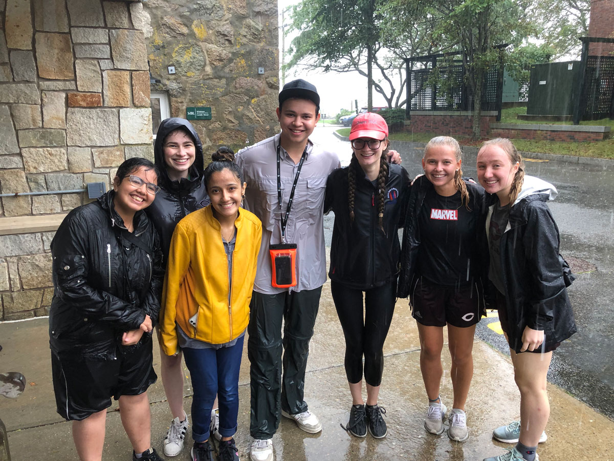 A rainy day didn’t deter UChicago students in the “Visualization and Biology” course from taking a trip on the MBL’s Gemma. Left to right: Sophia Lopez, Anna Rosloniec, Jacquelyn Caraveo, William Krakowka, Rachel Davies-Van Voorhis, Nikola Charouzova, and Elizabeth Brownfield.
