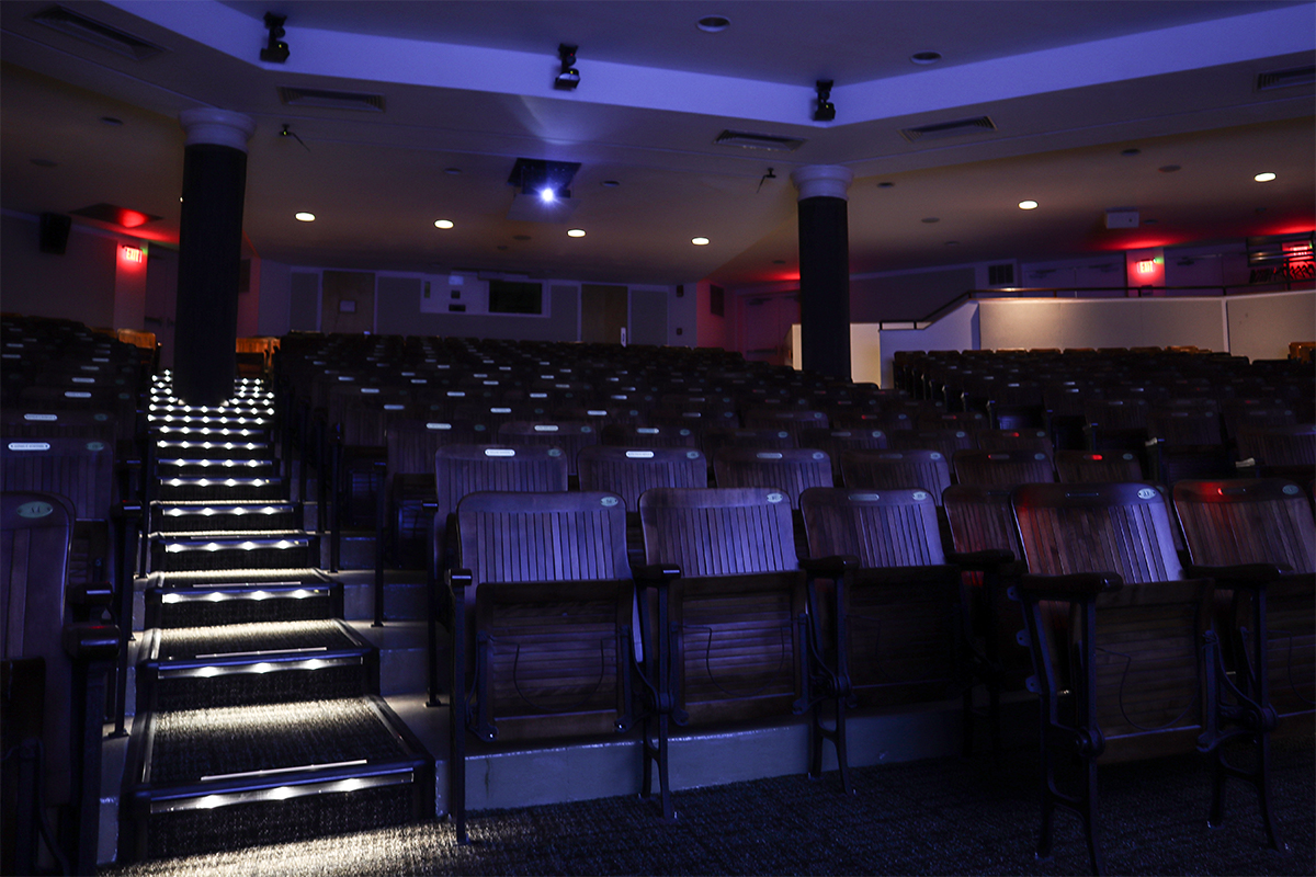 MBL Cornelia Clapp Auditorium with lights off showing safety lighting on floor