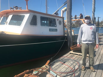 MBL Senior Captain Bill Mylett in March doing maintenance on The Gemma