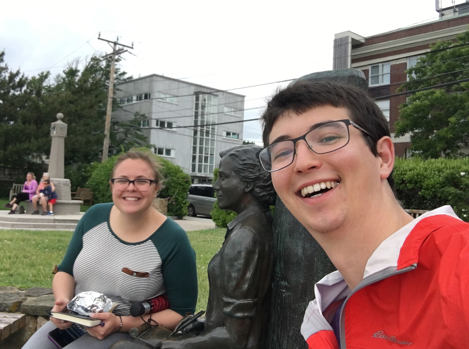 Katelyn Mika and Alexander Okamoto take a lunch break by the Rachel Carson statue in MBL’s Waterfront Park. Credit: Alexander Okamoto