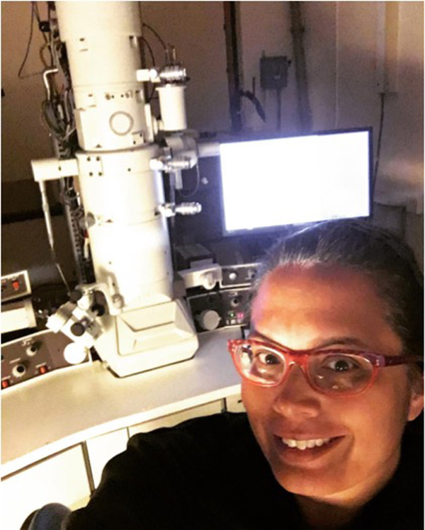 Martinez-Acosta works with a transmission electron microscope during a sabbatical at the MBL in 2016.