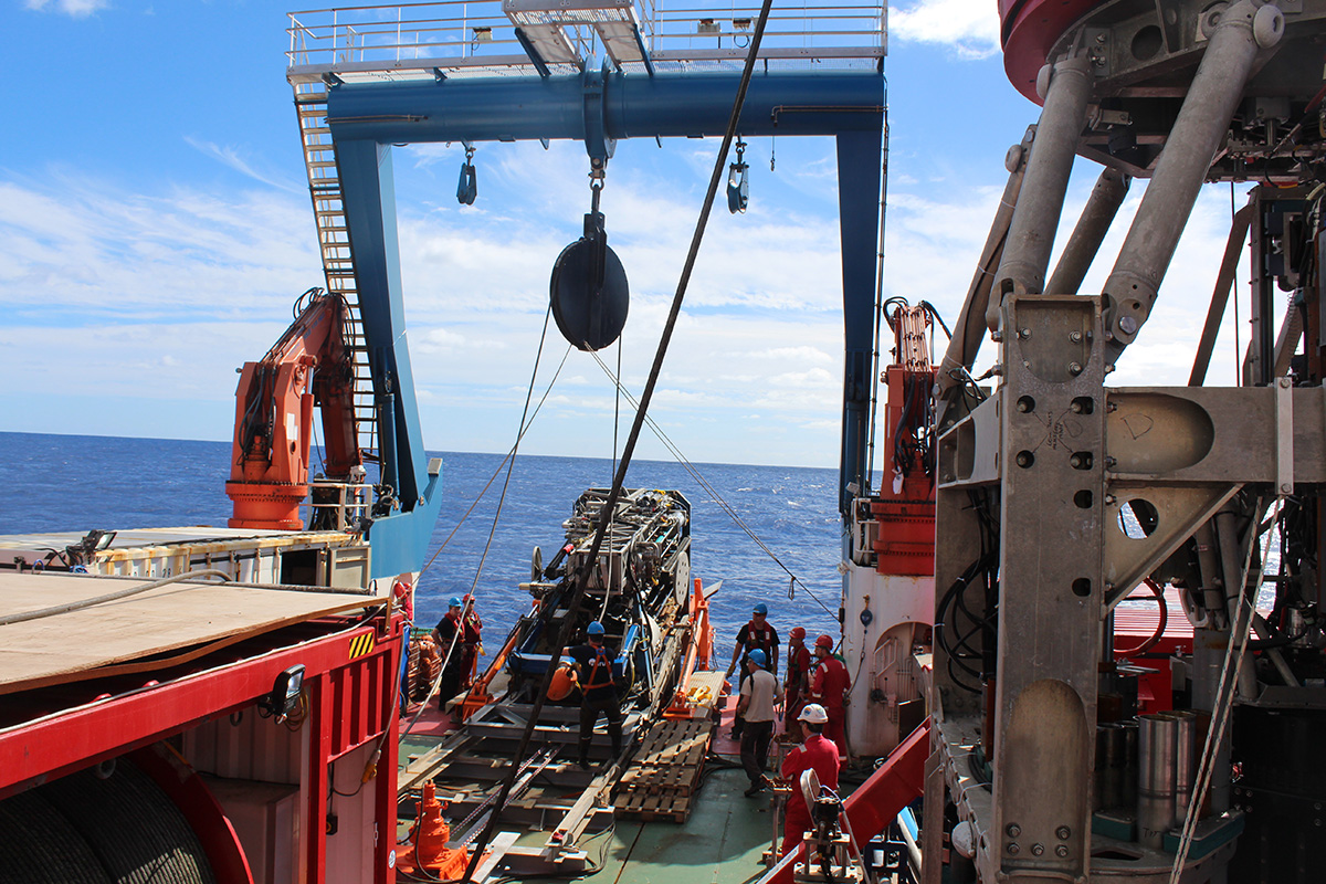 Integrated Ocean Drilling Program (IODP) Expedition 357 to the Atlantis Massif pioneered the use of seabed rockdrills equipped with sensors capable of monitoring in-situ fluid conditions during drilling. Such technology is enhancing scientists’ ability to understand conditions of the deep subsurface encountered by microbial life. Image courtesy of ECORD/IODP