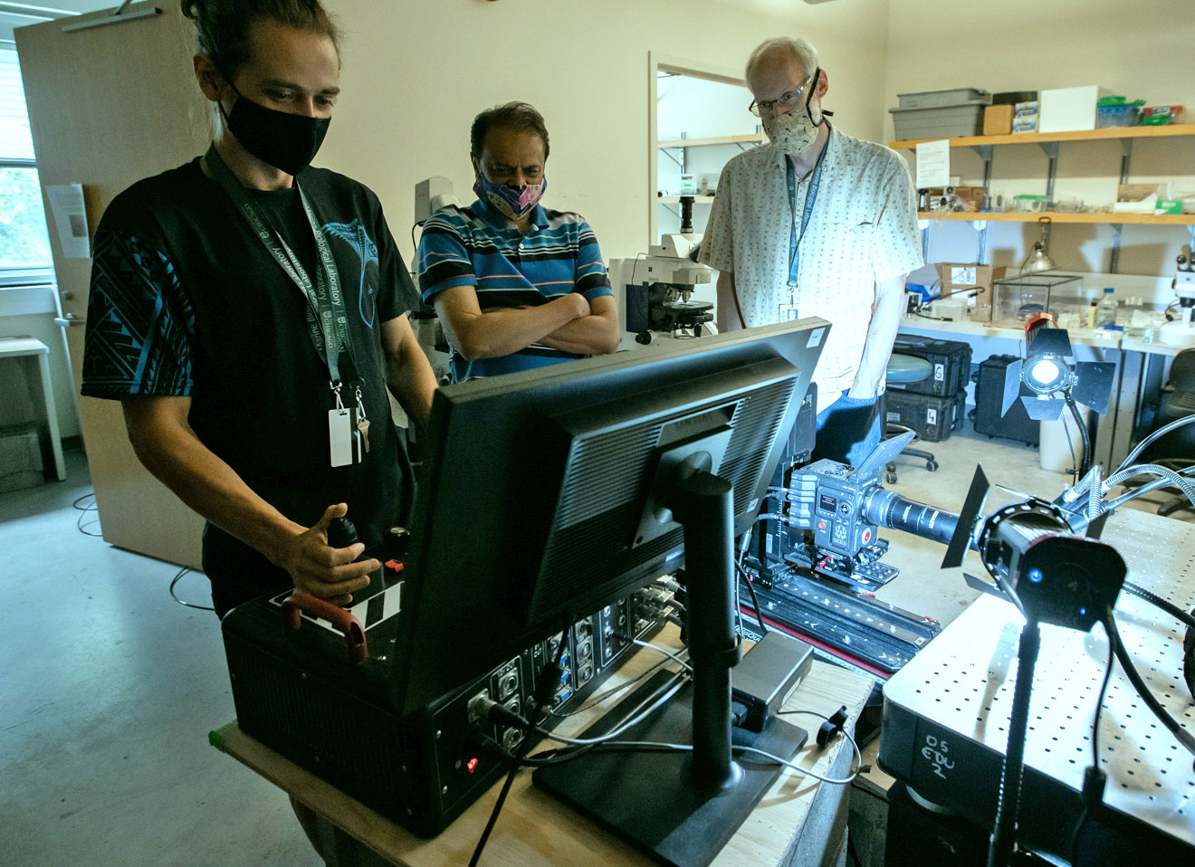 From left, Daniel Stoupin of BioQuest and Nipam Patel and Jon Henry of the MBL filming marine organisms at the MBL this summer. Credit: Pete West