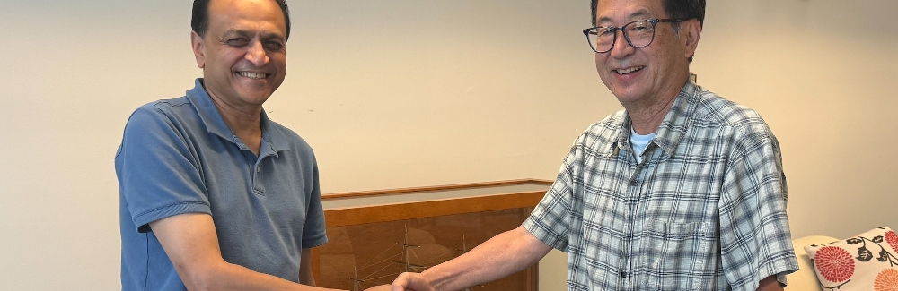 Nipam Patel and Mark Terasaki shake hands