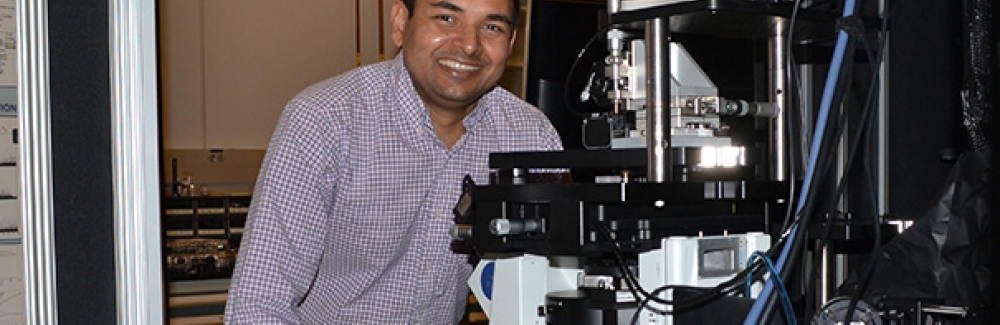 Abhishek Kumar with a super-resolution optical microscope he built.
