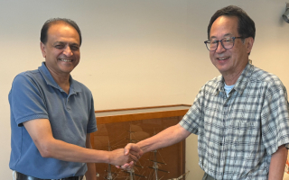 Nipam Patel and Mark Terasaki shake hands