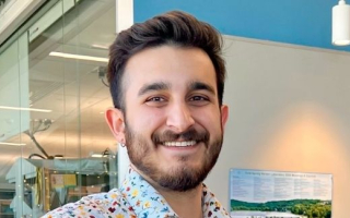 A scientist smiling at the camera