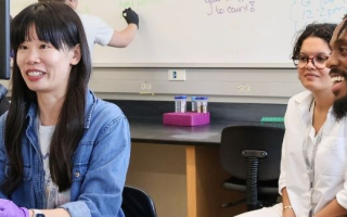 MOMY student Jinhong Xie learns to dechorionate zebrafish embryos as Caroline Almeida, and N’namdi Baker look on. Image credit: Lindsey Lubofsky