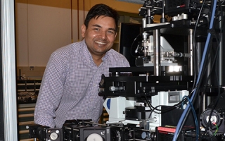 Abhishek Kumar with a super-resolution optical microscope he built.