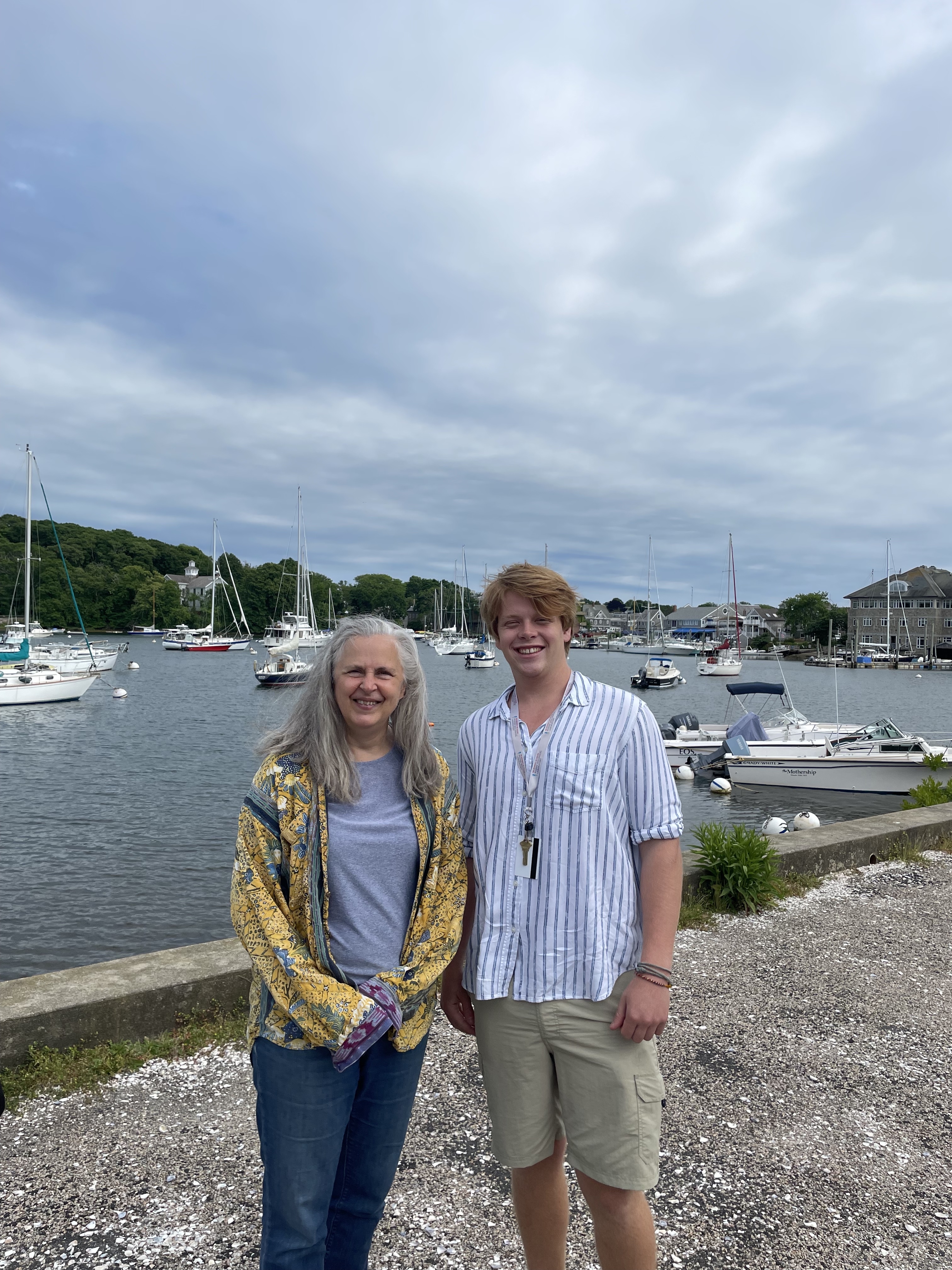 Ross Brown with his mentor MBL scientist Zoe Cardon stand in front of Eel Pond in Woods Hole. 