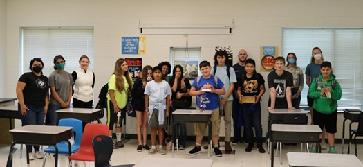 Group picture of Cape Fear Middle School students and UNCW graduate students.