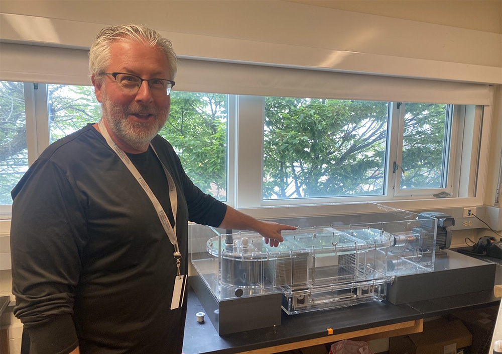 Neil Shubin with his fish treadmill for training fish to walk in his Whitman lab (Credit Diana Kenney)