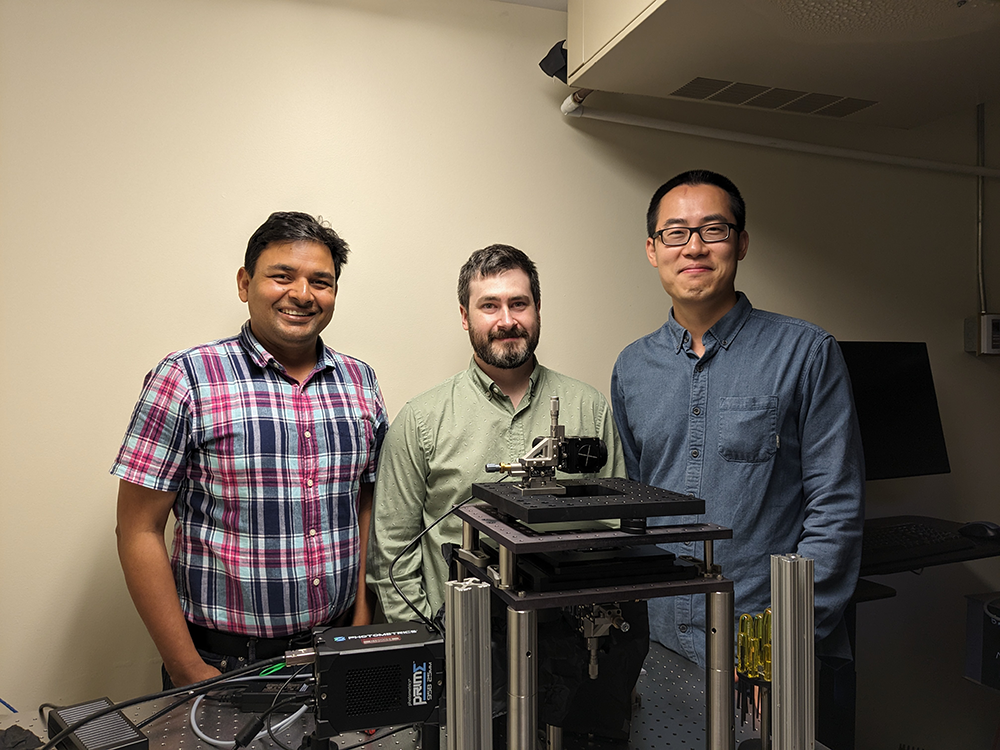 Yuan Ren (right) with MBL scientist Abishek Kumar (left) and his postdoc Matthew Parent (center). The Kumar lab’s microscopes were crucial to Ren’s work at MBL. Credit: William Ramos