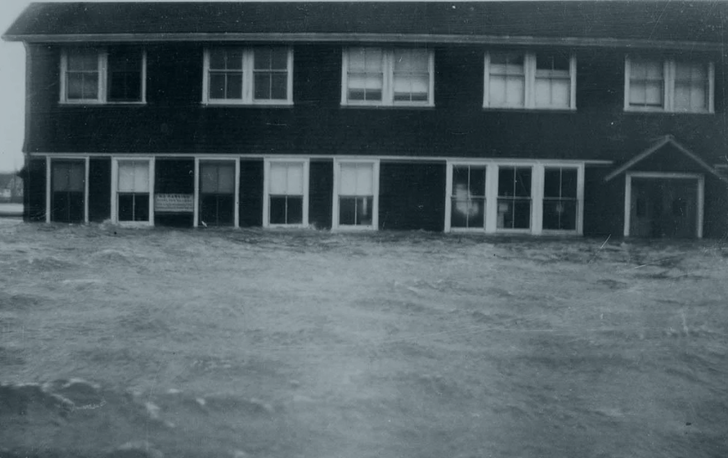 MBL's Supply Department Building in floodwaters during Hurricane of 1938. 