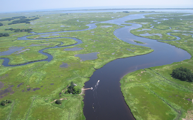 Rowley Field House on river in Plum Island Estuary.
