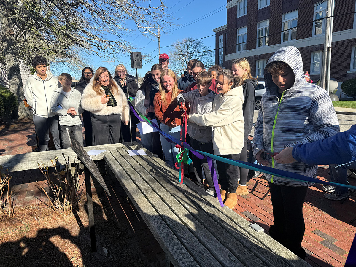 Falmouth High School Students cut the ribbon at the ceremony.
