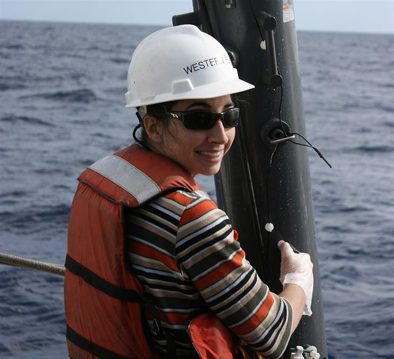 Woman on boat at sea participating in research
