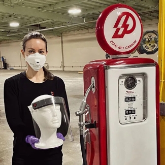 Amanda Martinez holds a face shield made for medical workers in the manufacturing facility of Silicon Valley-based Prometheus Fuels. Credit: Prometheus Fuels