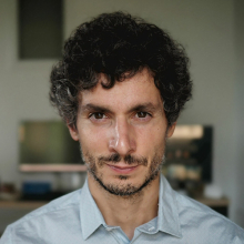 Male-presenting person with dark hair.