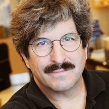 A scientist in a brown shirt