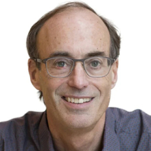 A scientist in a grey shirt