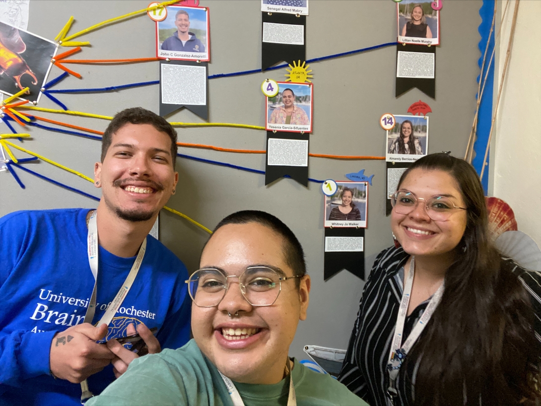 John Gonzalez-Amoretti (left), Yesenia Garcia-Sifuentes (center), and Almarely L. Berrios-Negron (right) stand in front of the SPINES bulletin board. Credit: Yesenia Garcia-Sifuentes 