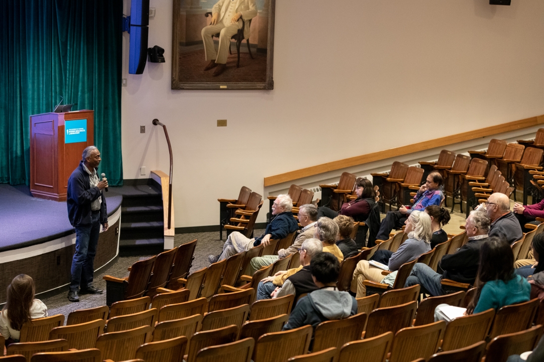 Embryology Course Director Athula Wikramanayake gives introductions in the Cornelia Clapp Auditorium during the Embryology 130th anniversary symposium at the MBL. Credit: Dee Sullivan 